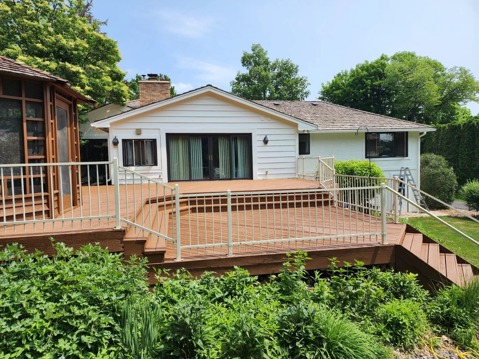 Full residential exterior painting update including siding and deck surfaces, completed by home painters mn.