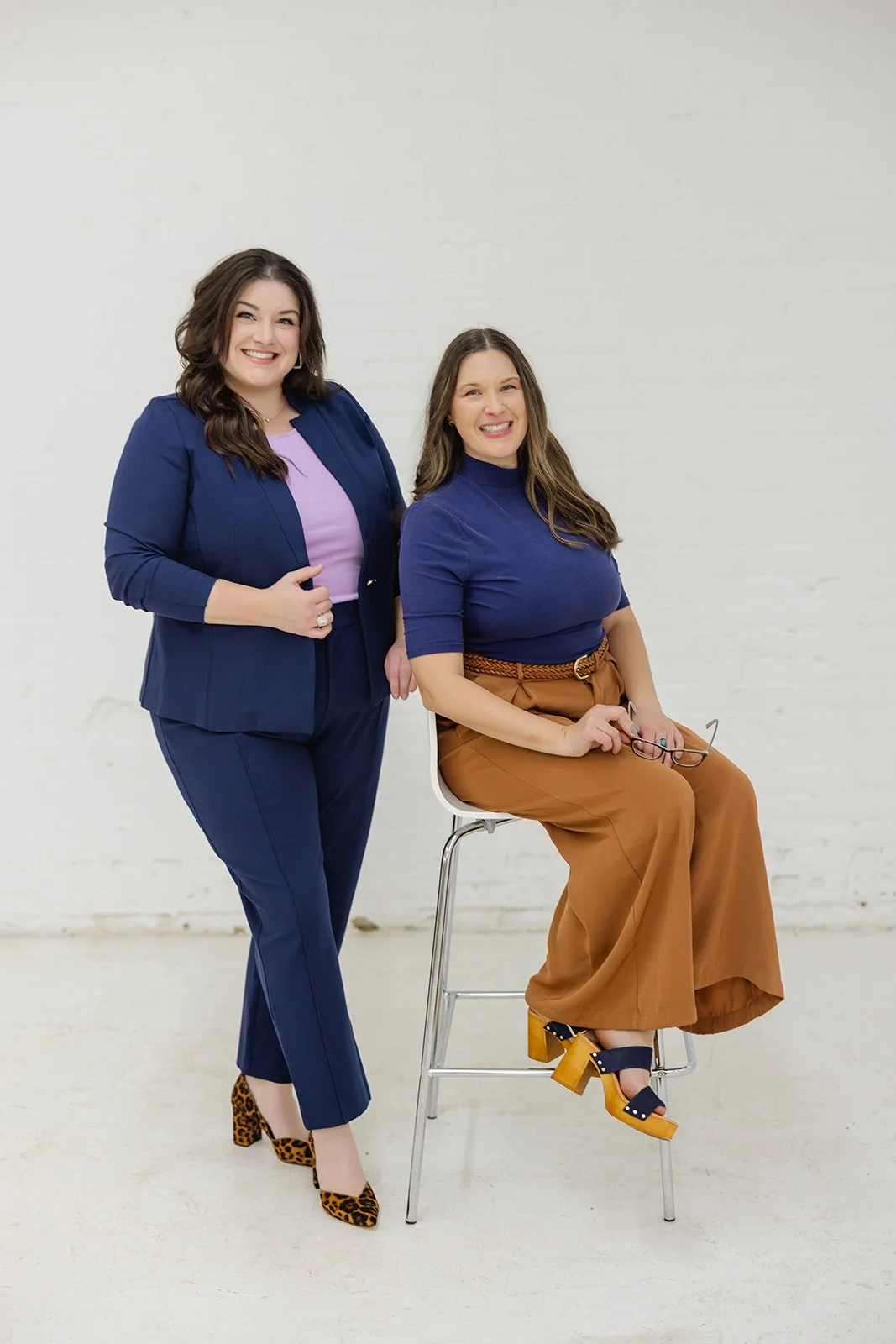 The professional founders of The List, premier Minneapolis interior painters, posing together for a team portrait.