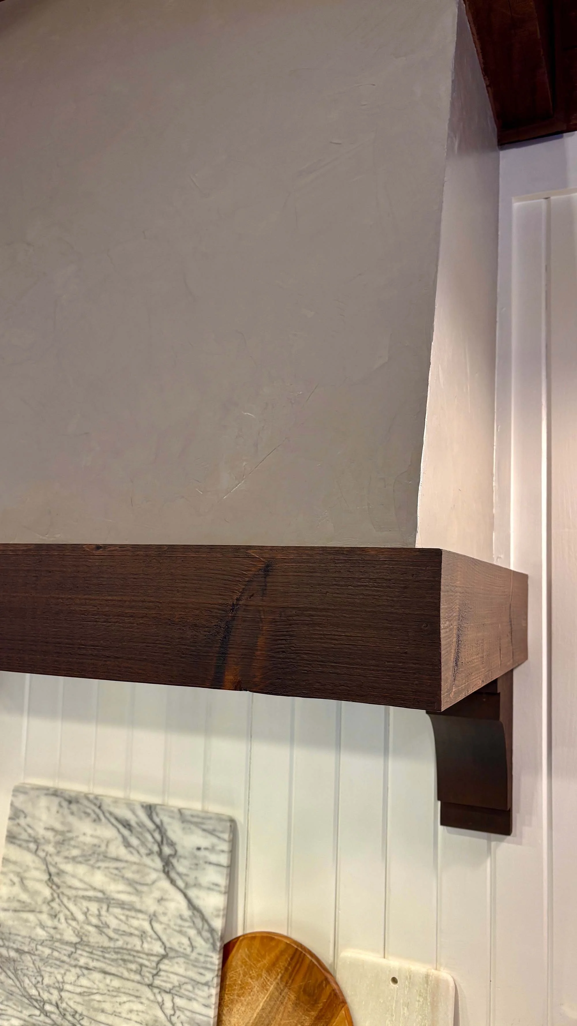 Close-up of roman clay texture on a wall with wood trim