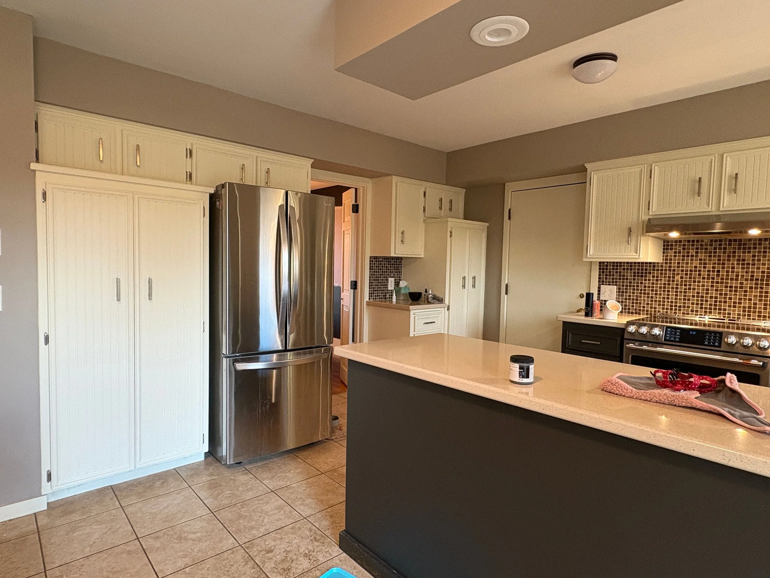 Full interior painting of a traditional kitchen layout, highlighting clean lines and professional finishes.