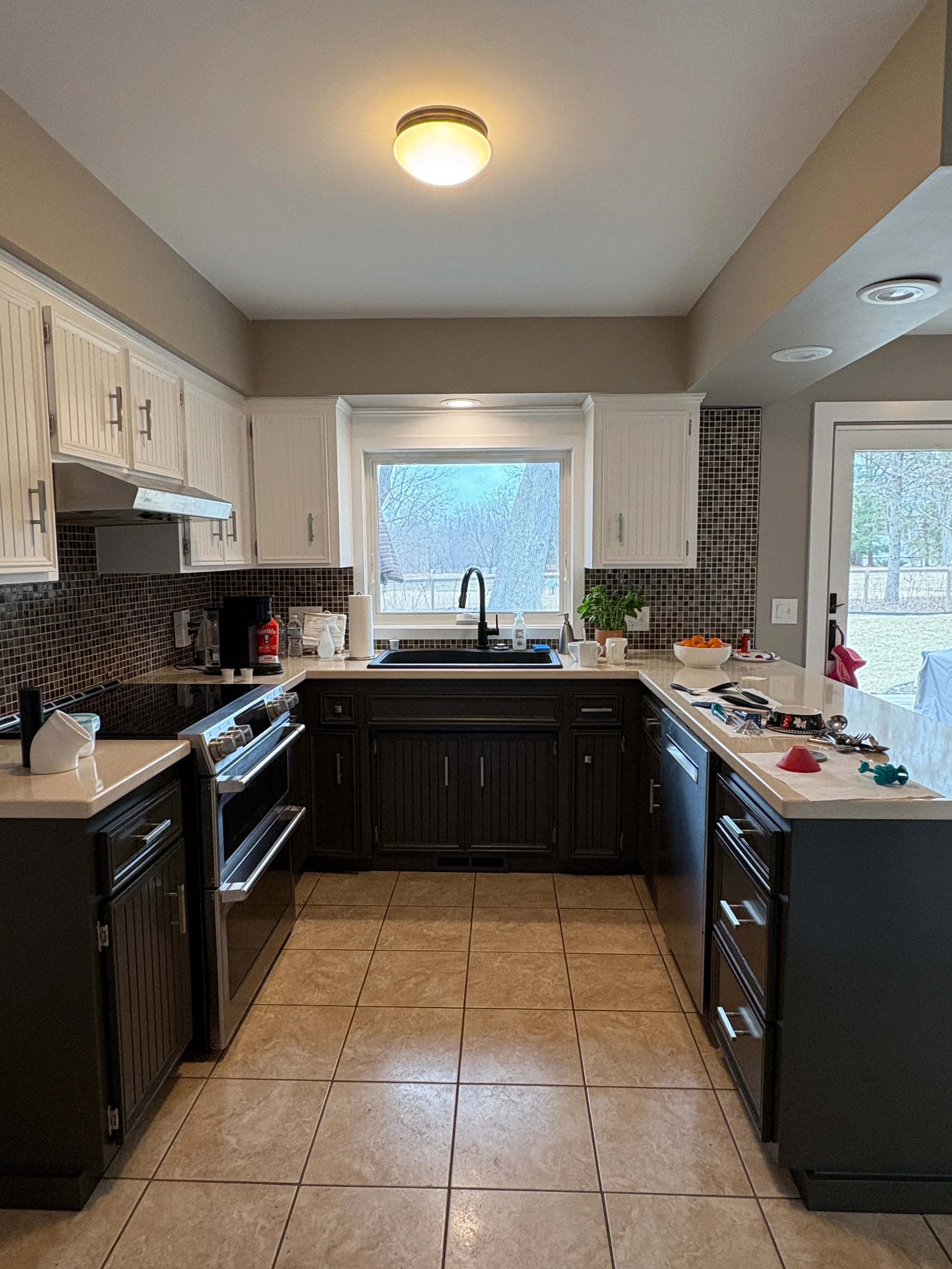 A full kitchen cabinet and wall transformation highlighting the meticulous work of professional home painters mn.