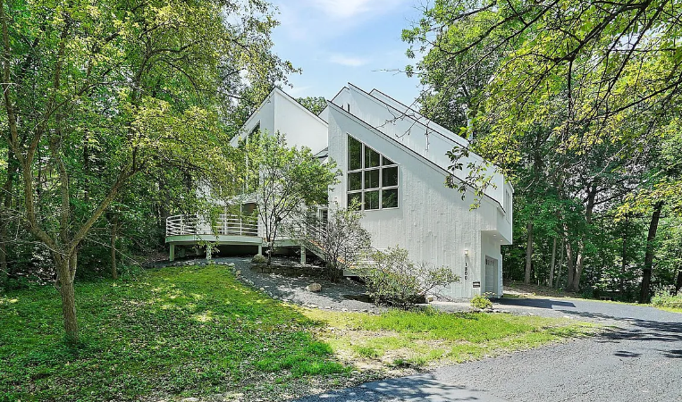 Full exterior refresh of a modern architectural home showcasing the quality of professional home painters mn.