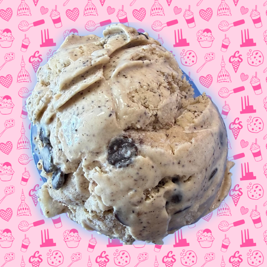 Coffee ice cream with chocolate pieces mixed throughout on a pink Capital City Sweets patterned background.
