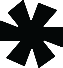 A black asterisk-like symbol with eight points against a black background.