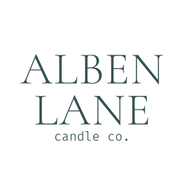 A sign reading "Alden Lane" in green text with a stylized tree and the words "GARDEN GALLERY."