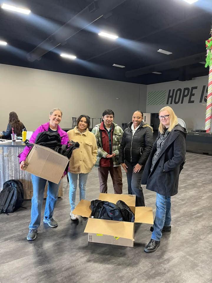 Photo of a group of volunteers collecting winter wear donations.