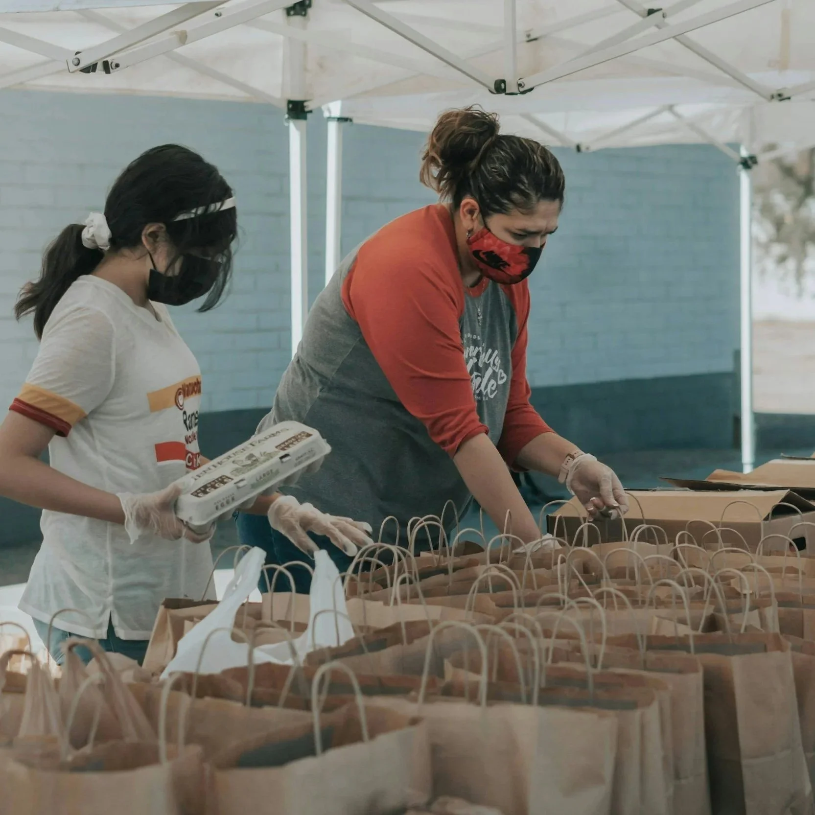 Volunteers assembling Welcome Home Kits for new DAHC residents.