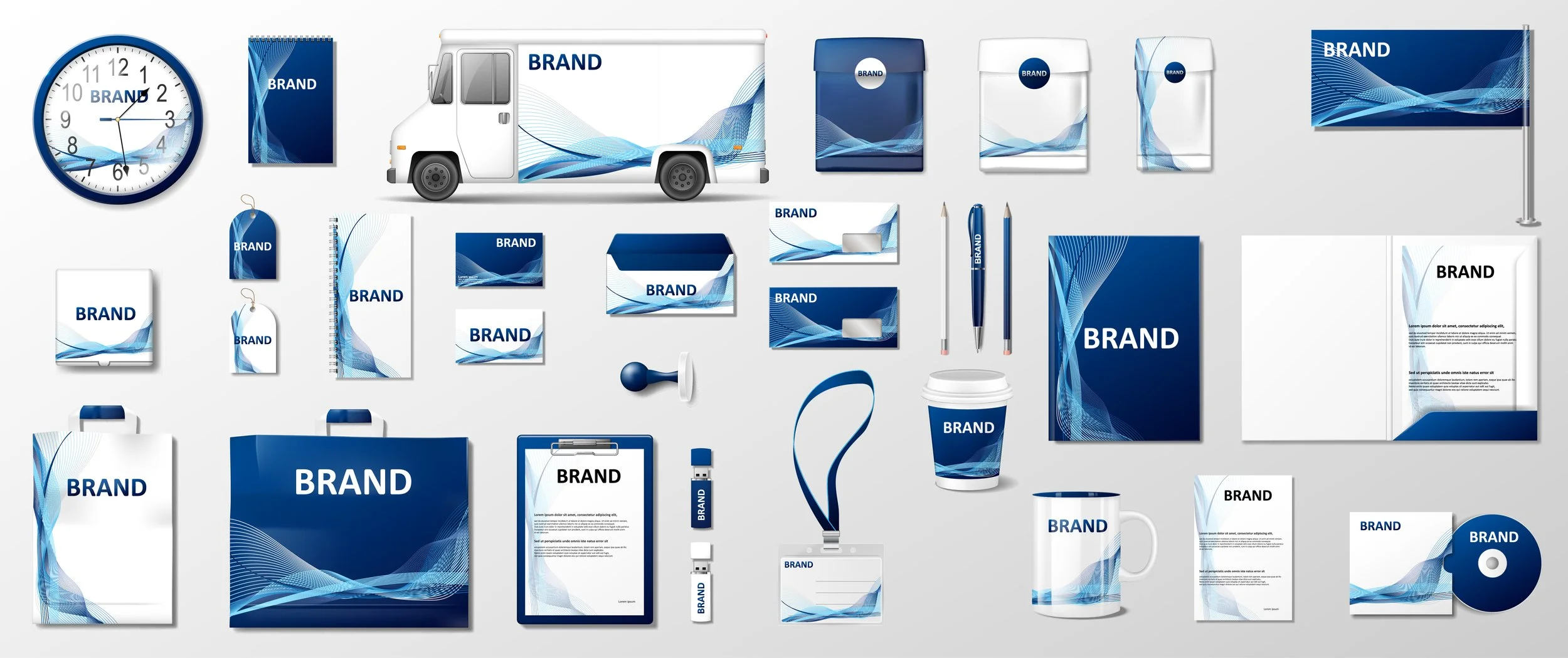Collection of various branded office and promotional items, including clocks, notebooks, notepads, packaging, a delivery truck, pens, a keychain, a coffee cup, a lanyard, a mug, a folder, a pen drive, a DVD, and a small flag, all featuring a blue and white abstract wave design.
