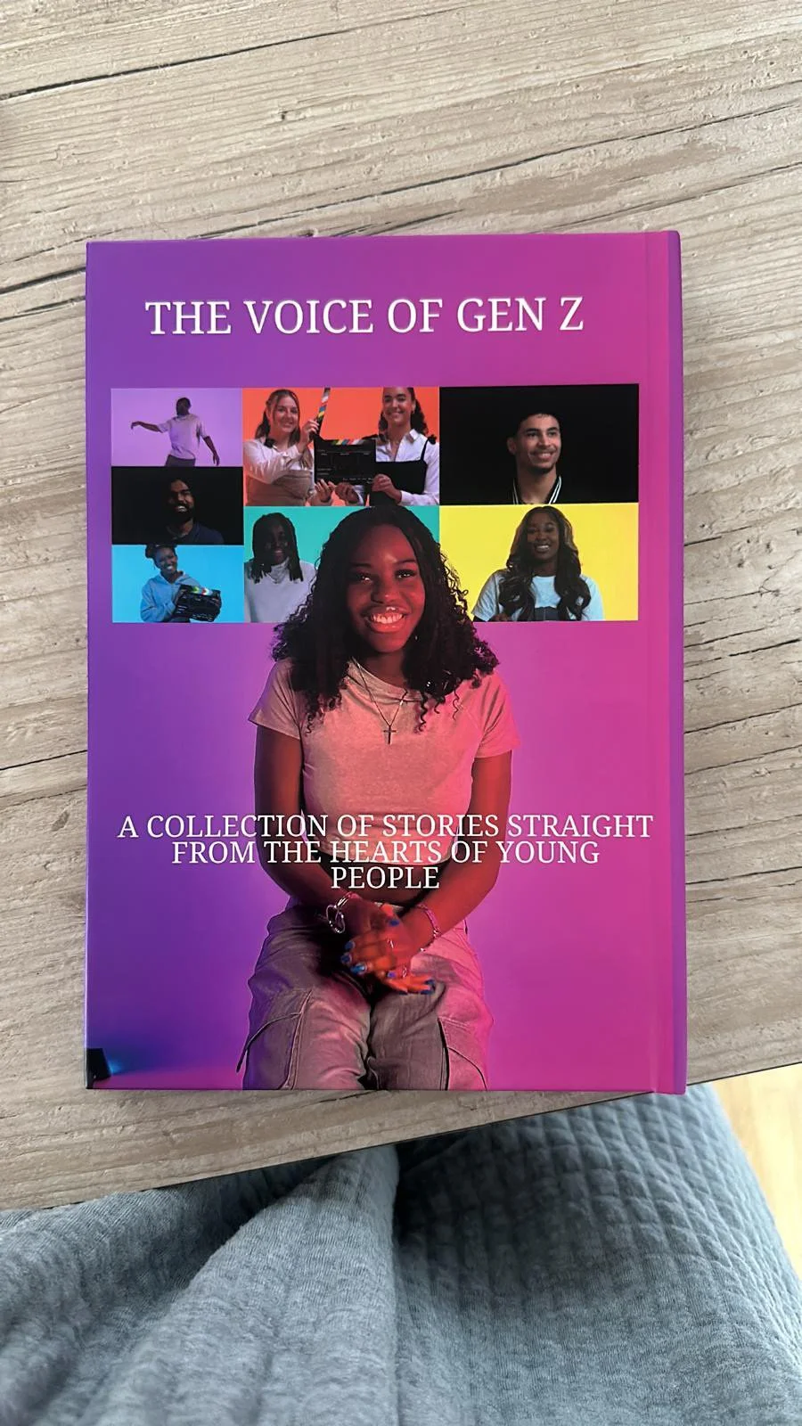 Book titled 'The Voice of Gen Z' with a cover featuring a young girl with curly hair sitting on a purple background, surrounded by smaller images of diverse young people in different settings.