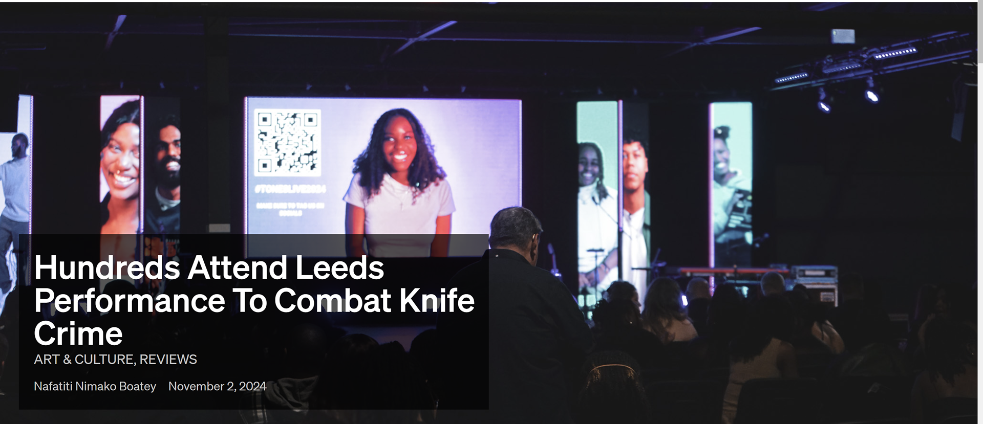 Audience watching a stage presentation with large screens showing images of diverse individuals at a conference or event in Leeds, with a headline about a performance to combat knife crime.