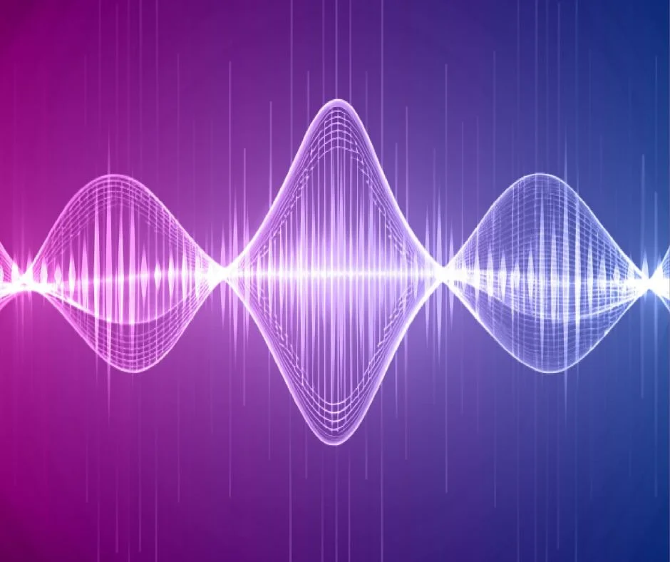 Digital illustration of a glowing, colorful sound wave pattern against a dark background.