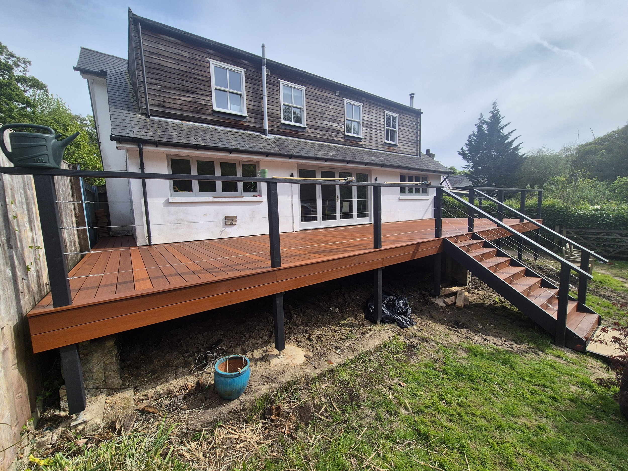 Wooden fence with grass at the bottom.