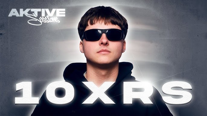 Young man wearing sunglasses and a black hoodie, with text 'ACTIVE' and '10XRS' in the background.