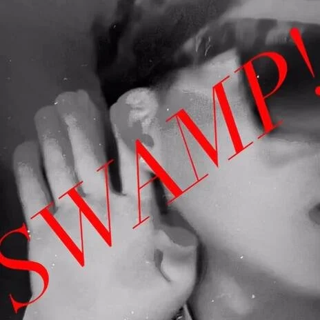 Two people kissing with a red text overlay that says "SWAMP!".