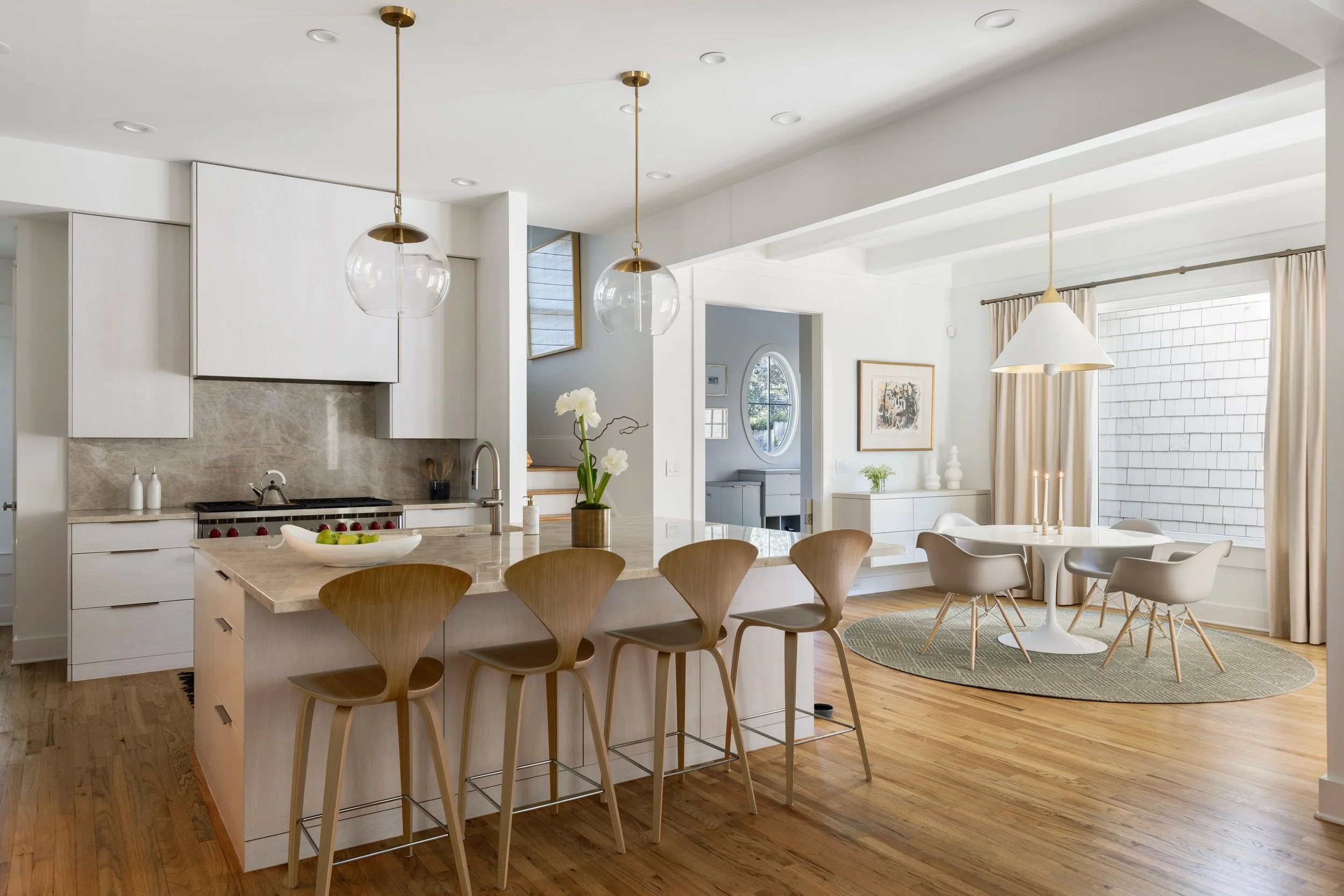 A kitchen designed to feel both timeless and inviting.

By combining light wood tones, natural materials, and soft finishes, we created a space that feels bright, warm, and functional for everyday living.

I love how the kitchen and breakfast area fl