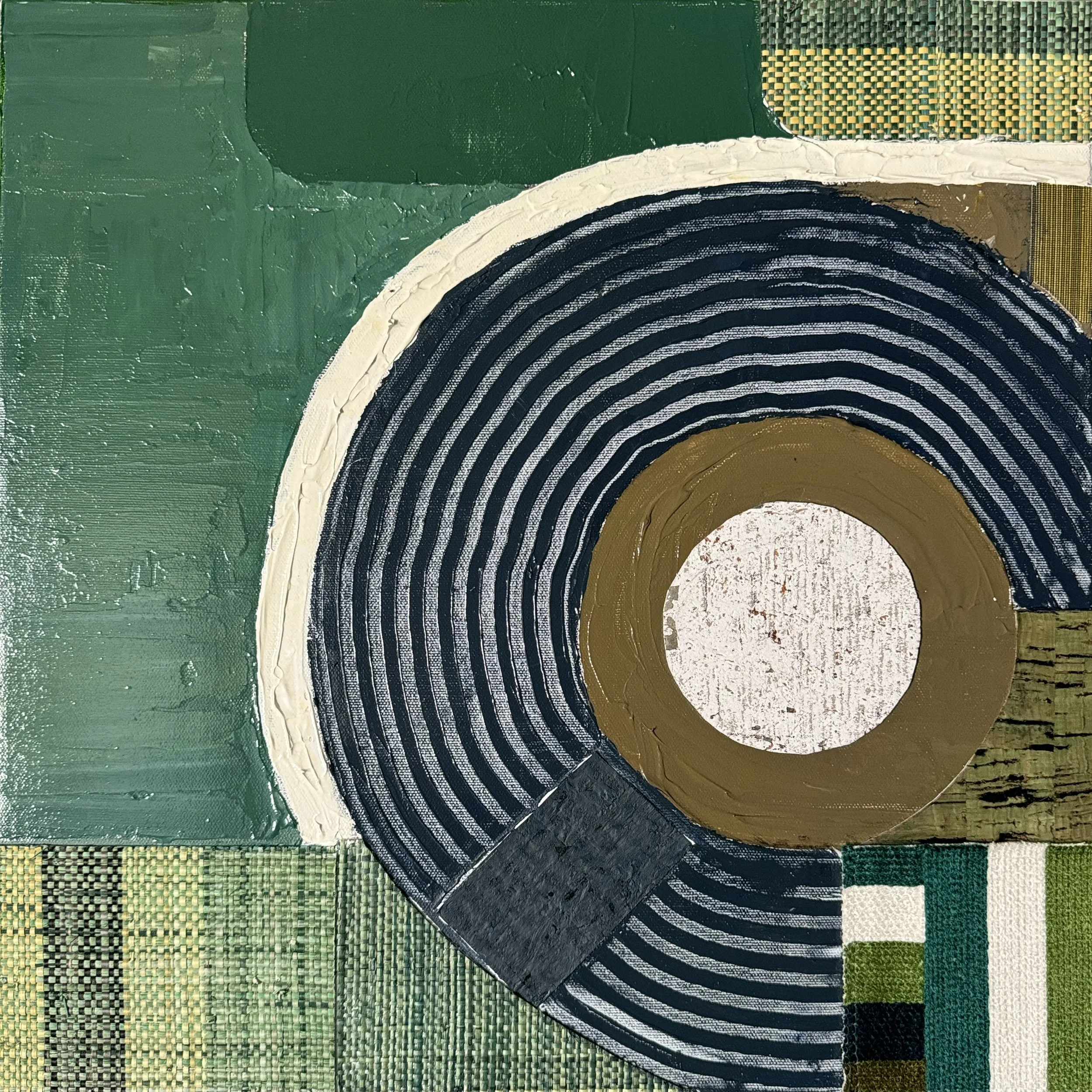 Abstract artwork featuring concentric circles in black and white, with a central white circle, surrounded by green, gold, black, and patterned sections.
