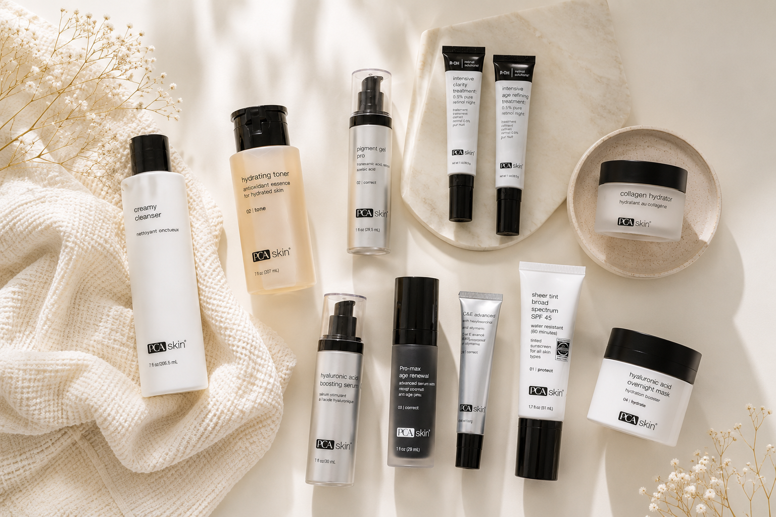 Elegant flat lay of professional PCA SKIN skincare products arranged in soft natural light for wedding and special event skincare planning at Eleva Glow Med Spa in Woodbridge, VA