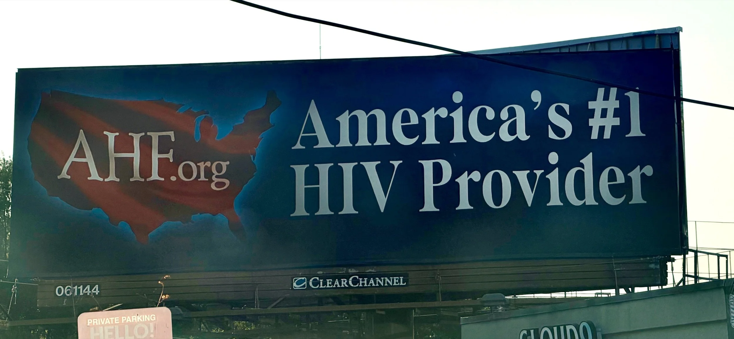 AHF.org billboard in Atlanta reading "America's #1 HIV Provider" beside a map of the United States.
