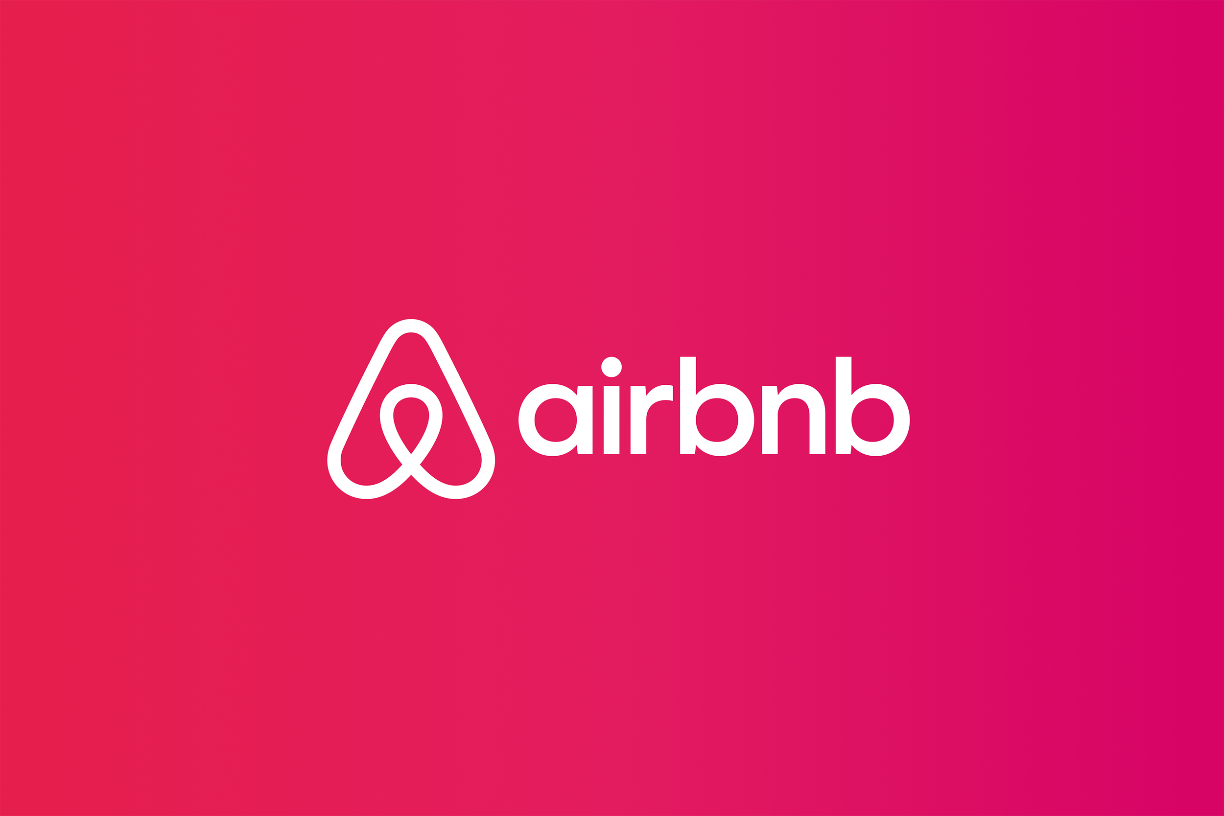 The Airbnb logo on a pink background.