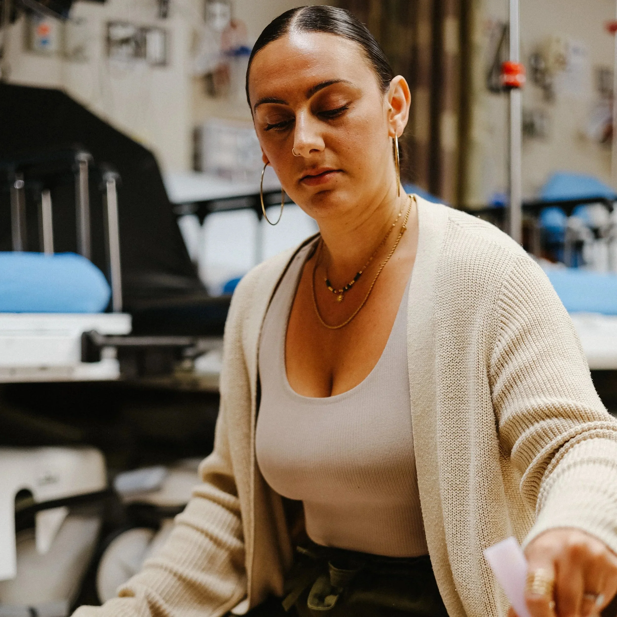 Sync'd wellness team leading workplace sound healing session supporting employee relaxation and focus