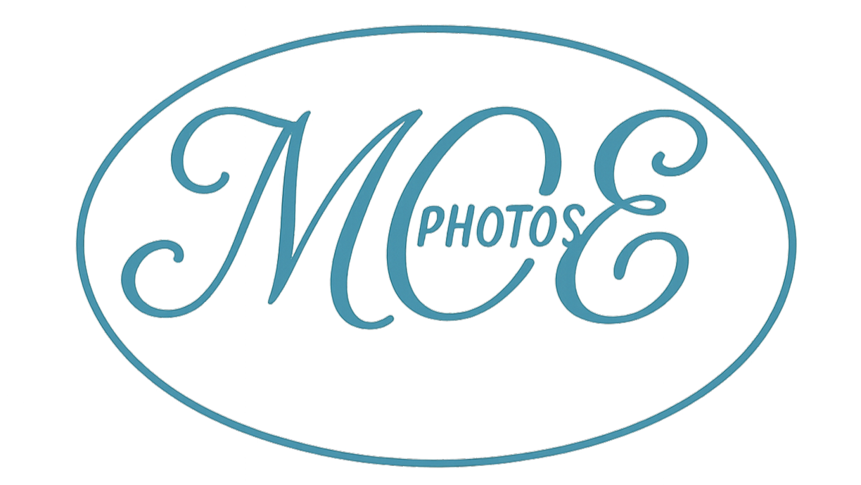 Logo for MC Photos with a stylized blue script font inside an oval outline.