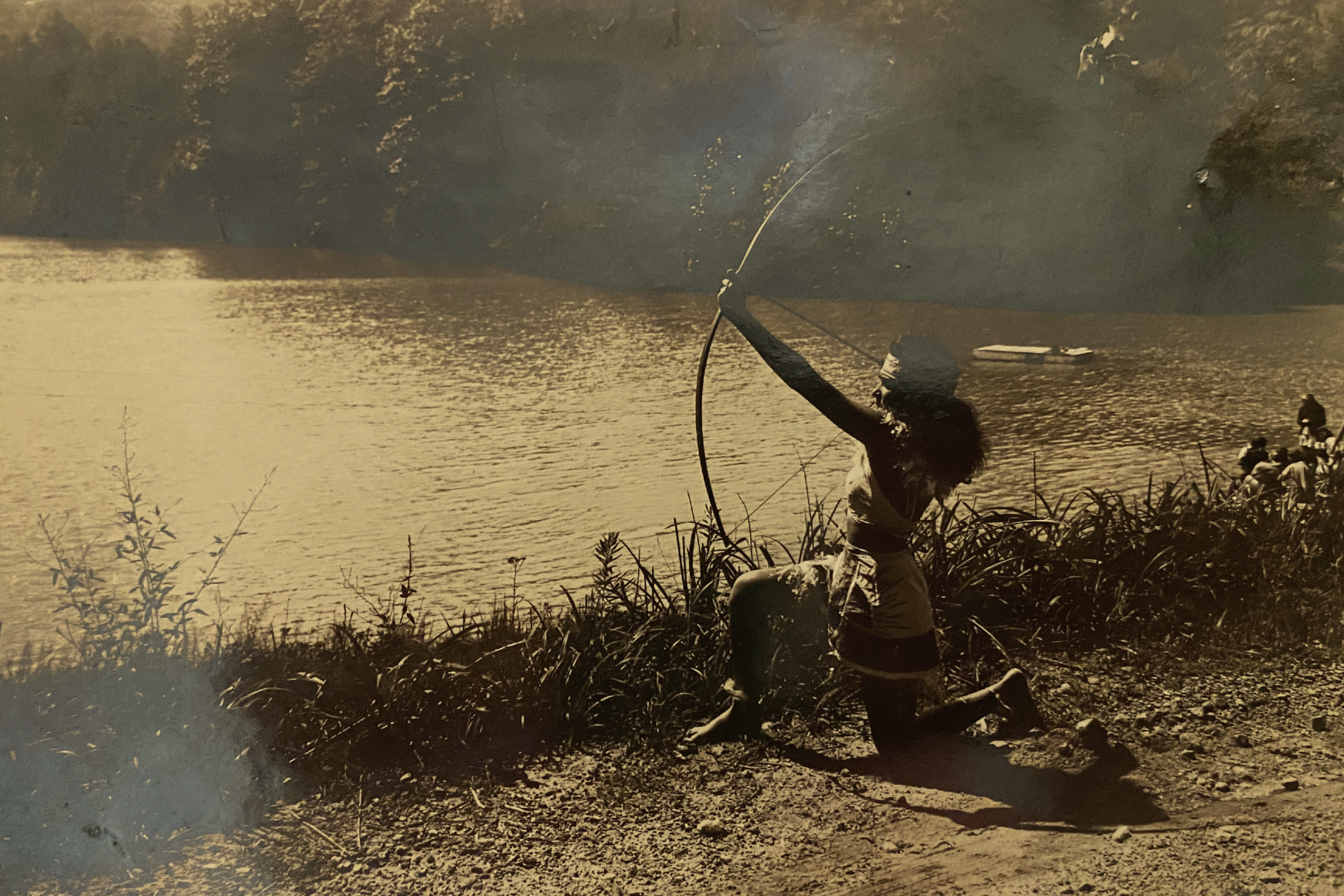    A camper at Camp Ton-A-Wandah (Flat Rock, NC), dressed as a Native American woman with bow and arrow, c. 1930s.   