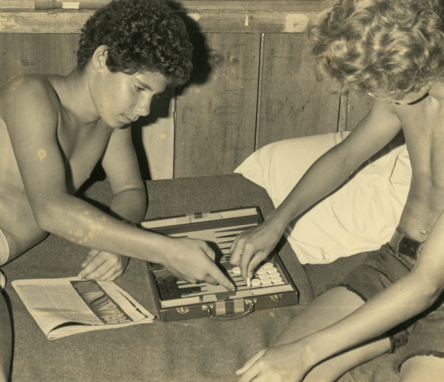    Camp Mondamin (Tuxedo, NC) campers play a game of backgammon, c. 1970s–1980s   
