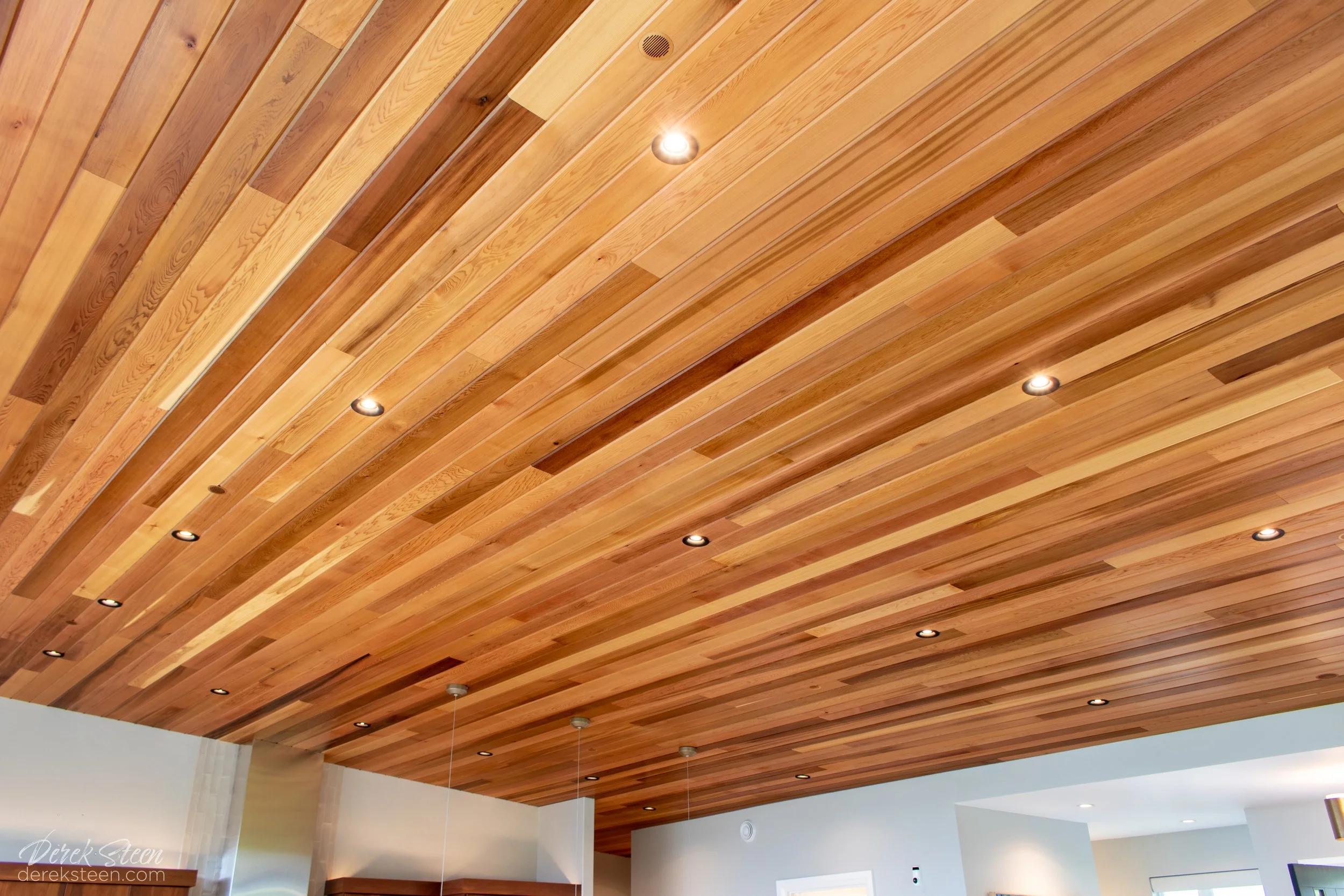 Wooden ceiling with recessed lighting in a modern interior