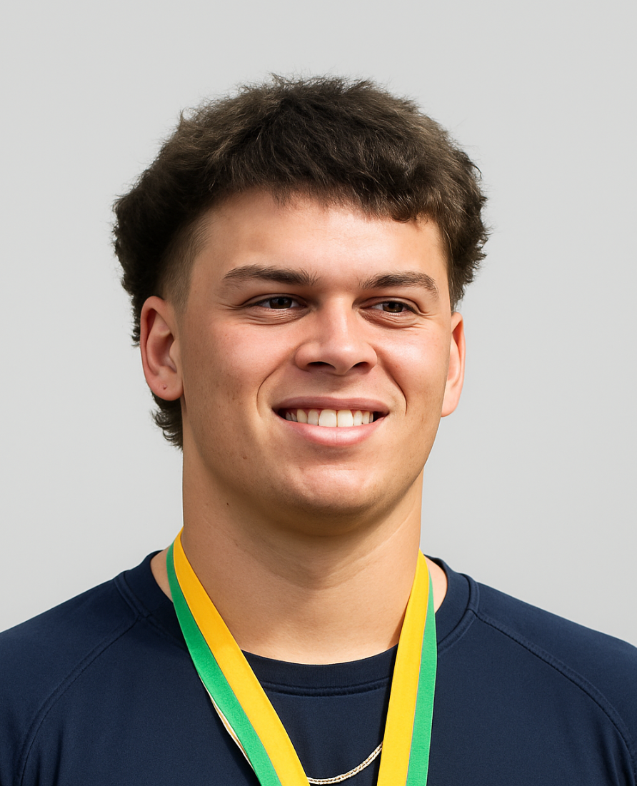 Young man smiling with medals around his neck, wearing a dark athletic shirt, against a plain background.