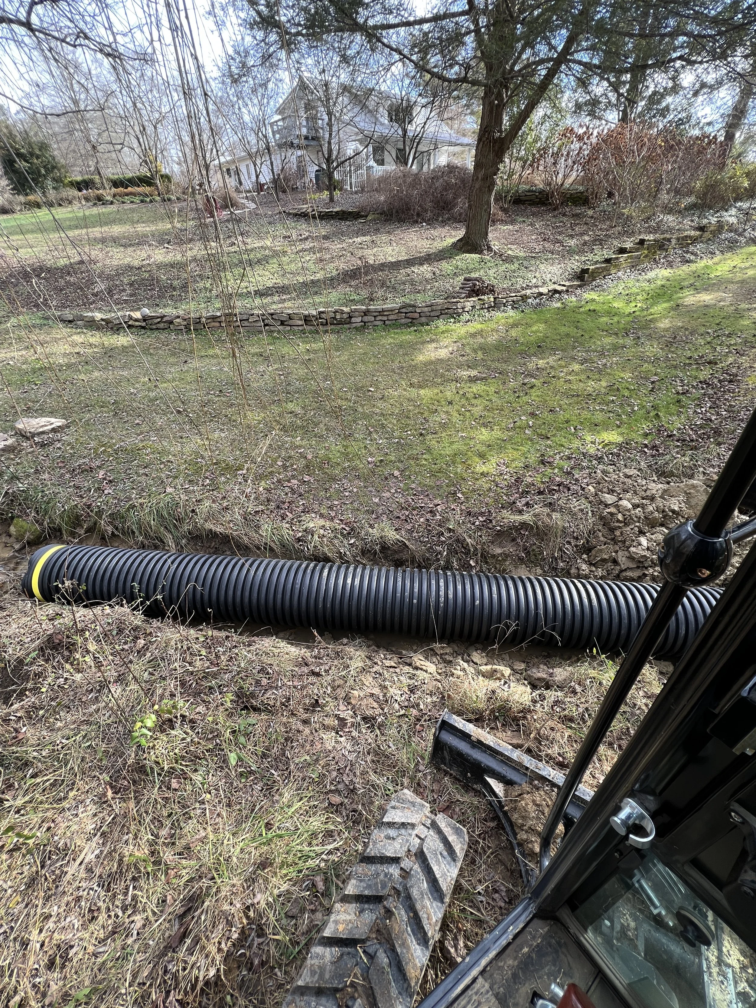Drainage ditch shaping Corbin Kentucky skid steer grading