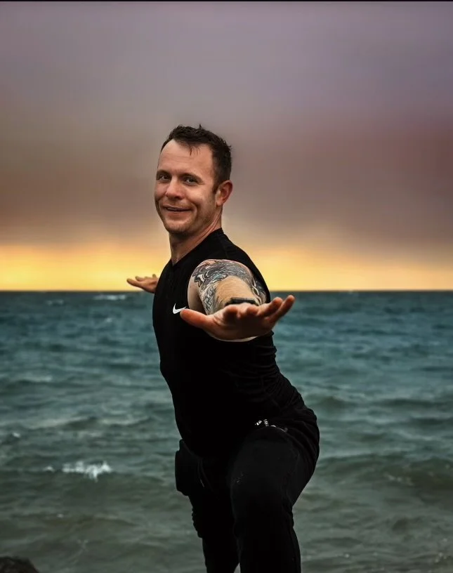 Steve Johnson welcoming you beside the water at sunset