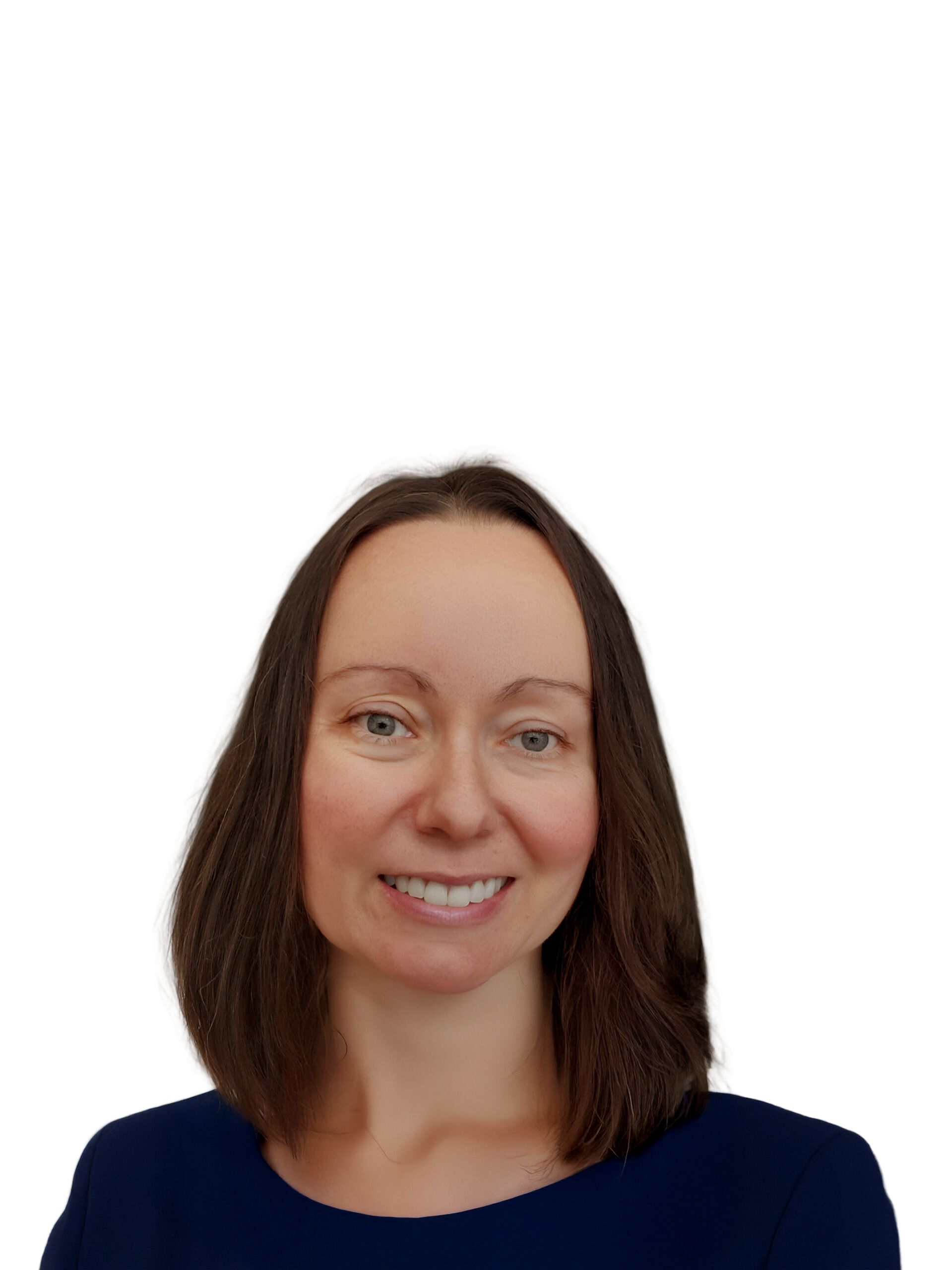 A woman with long dark hair smiling, wearing a navy blue shirt with white polka dots.