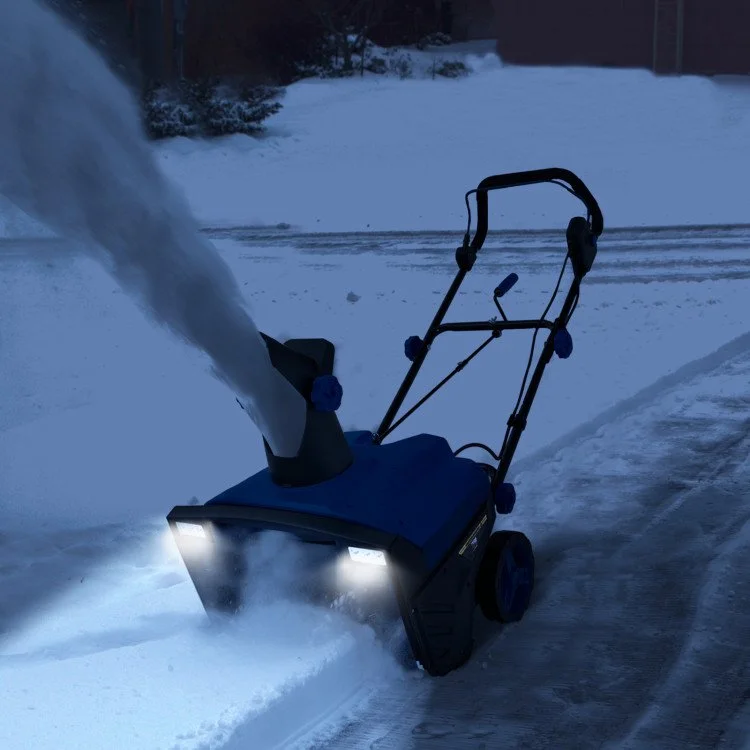 Commercial-grade snow blower clearing driveways and walkways during winter snow removal services.