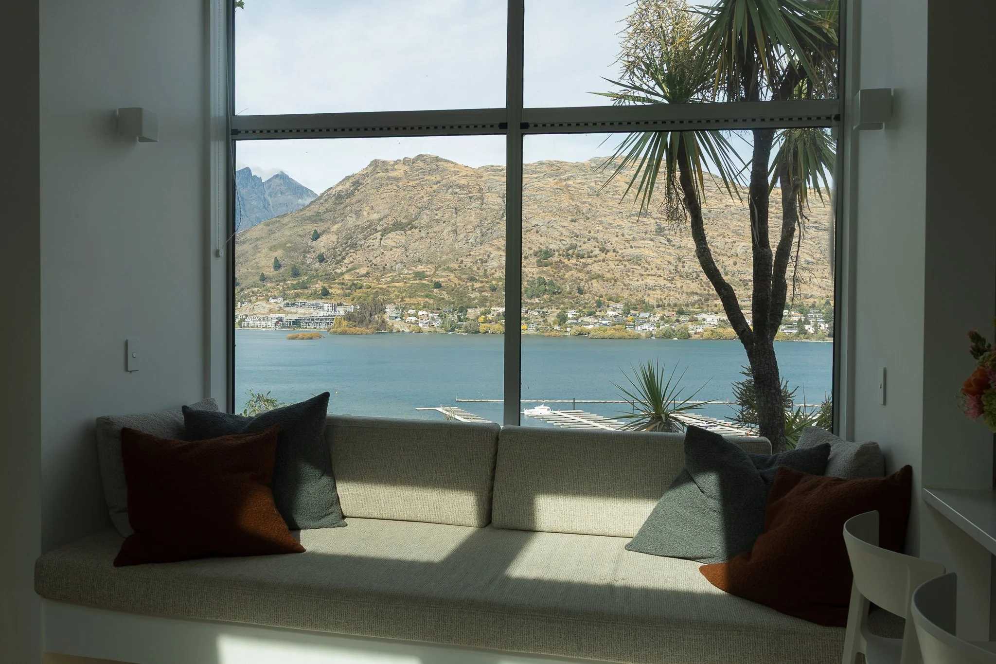 View over Lake Wakatipu to the mountains from elopement couples Airbnb in Queenstown