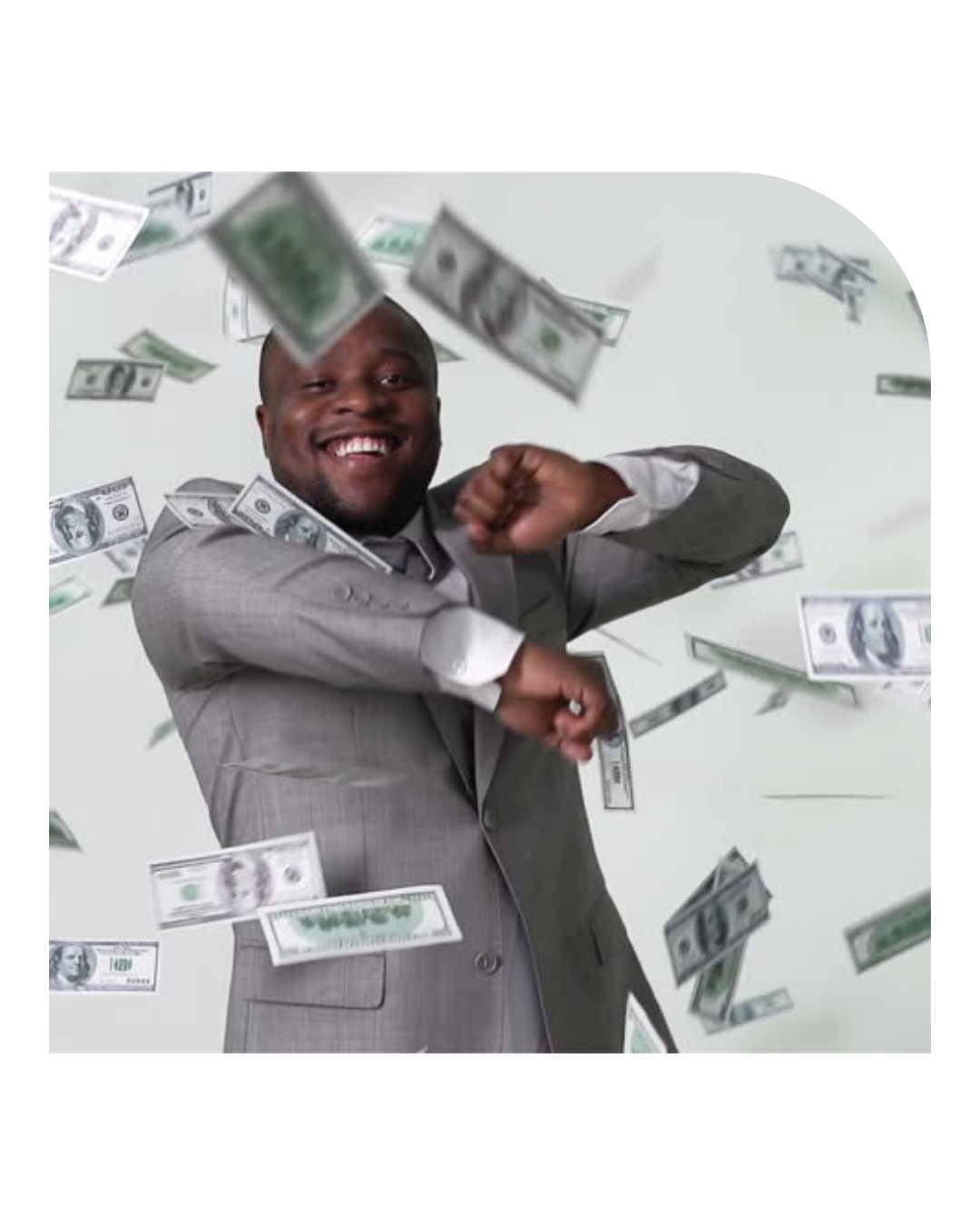 A man in a suit smiling and flexing his arms while money rain surrounds him.