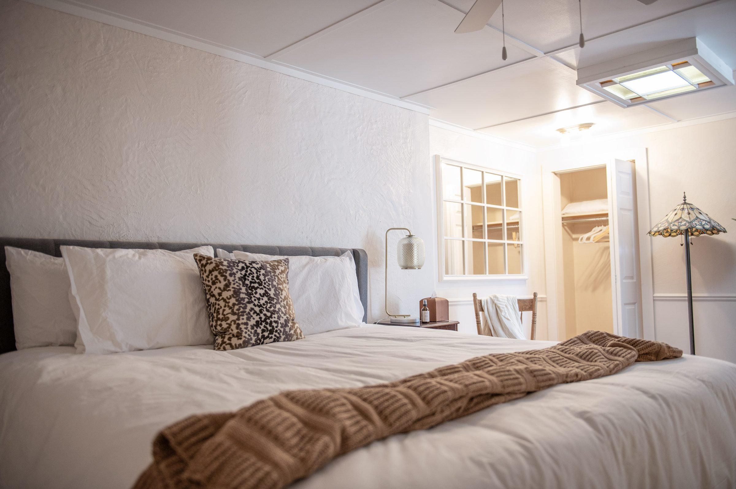 Room 3 at Park House Inn: queen bed with a cozy knit throw