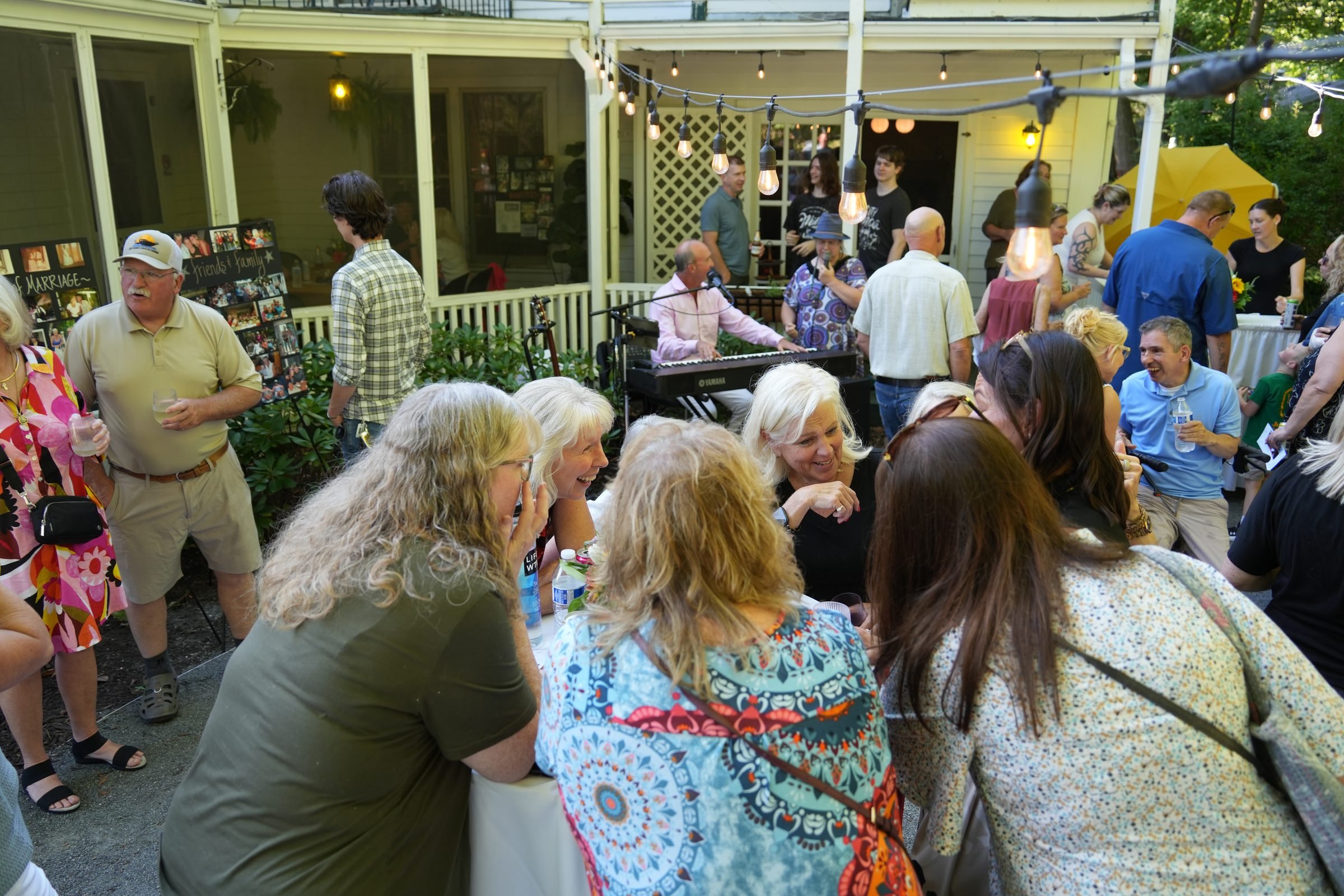 Guests gathered on the wraparound terrace during a cocktail hour at Park House Inn