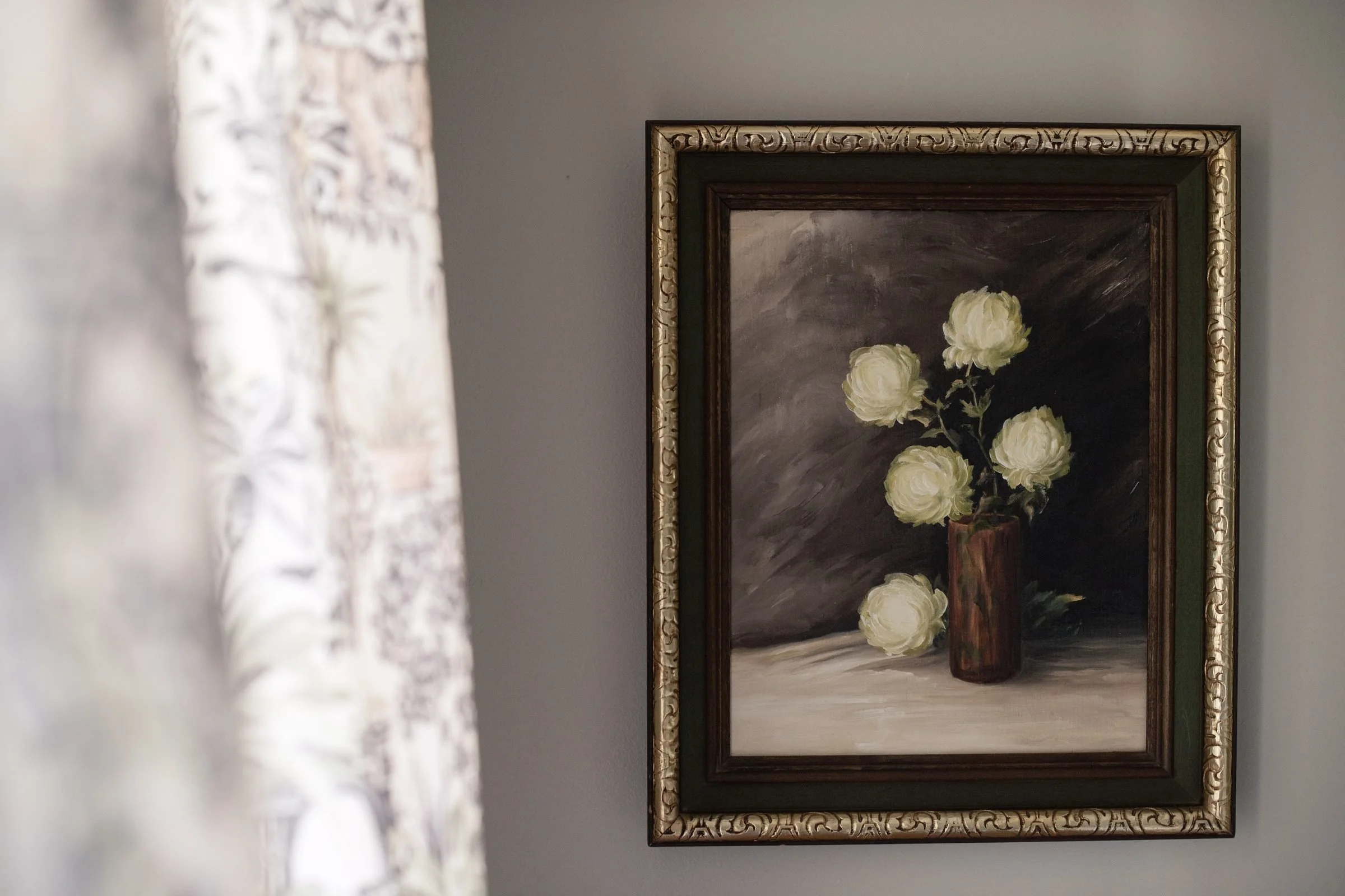 Room 1 at Park House Inn: a painted still life above an antique table