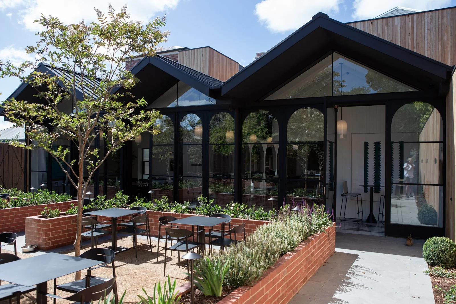 Commercial window cleaning Geelong — cafe or restaurant with arched glass conservatory and outdoor dining area