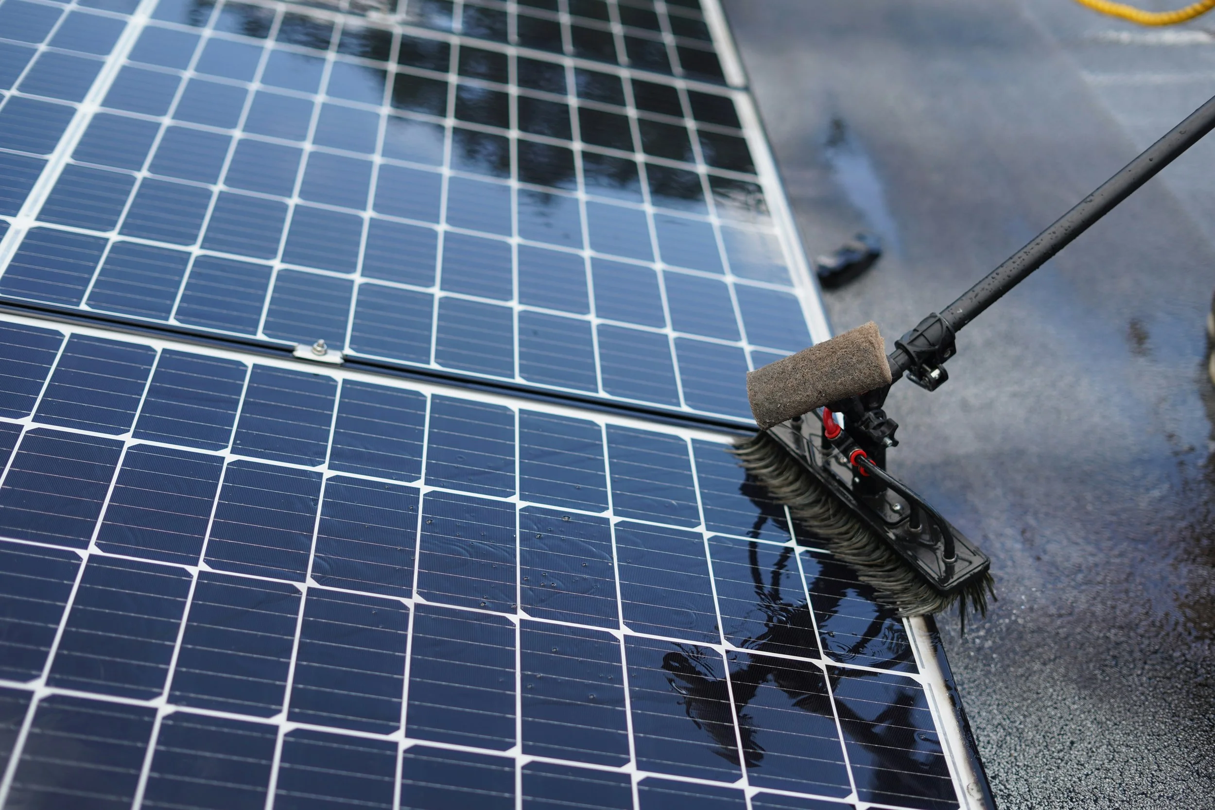 Solar panel cleaning Surf Coast — water-fed brush cleaning residential solar panels on rooftop