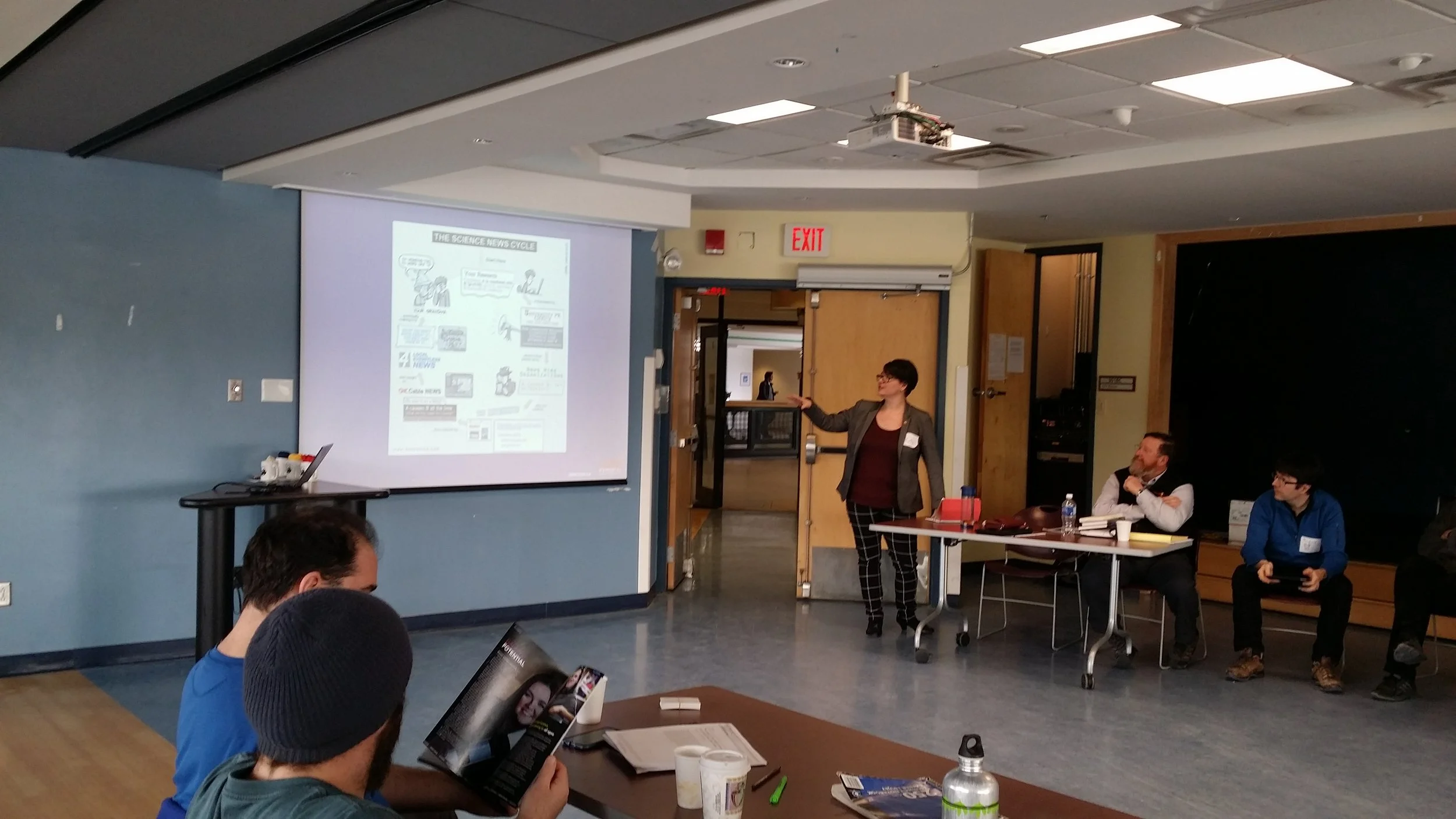 Presenter discussing communications cycles