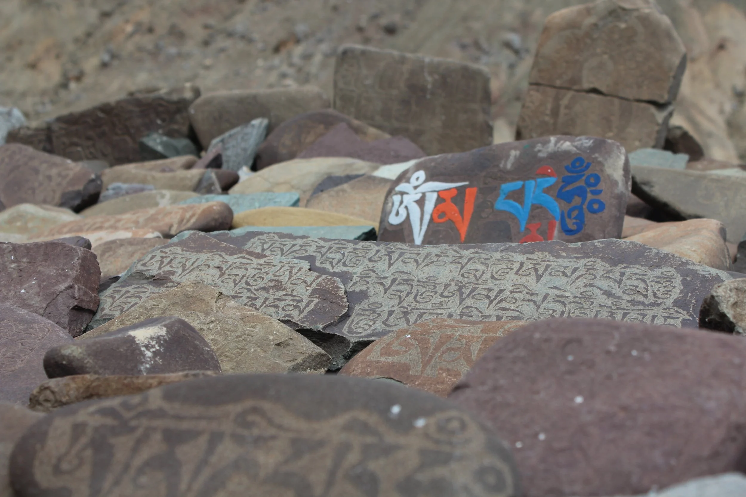 Rock art "Mani Stones" of Tibetan Buddhism