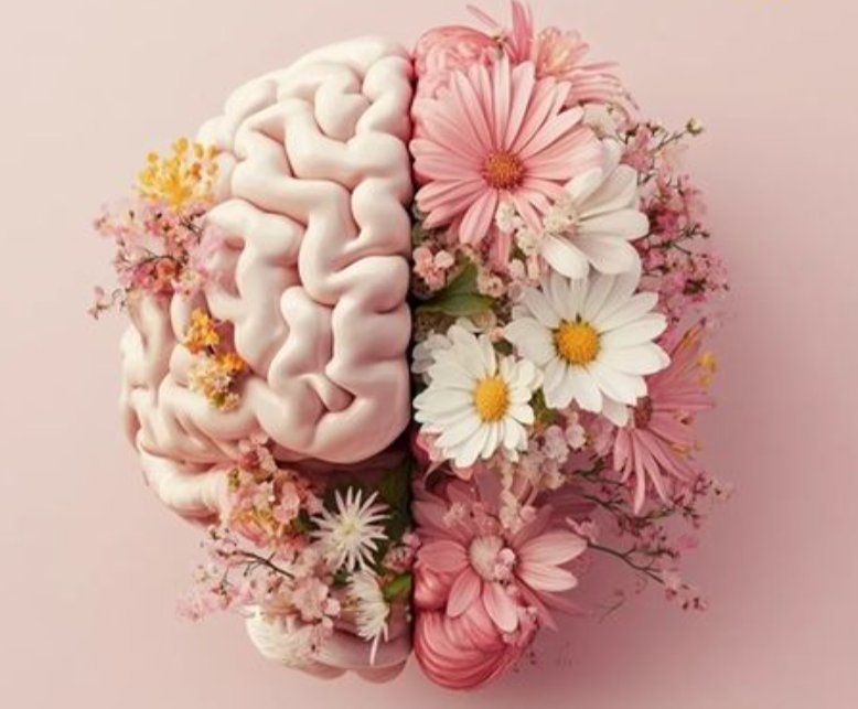 A model of a human brain surrounded by pink and white flowers against a light pink background.