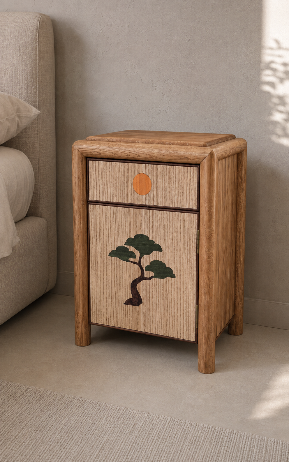 A  bedside cabinet with a drawer and a door, featuring a painted green tree on the door.