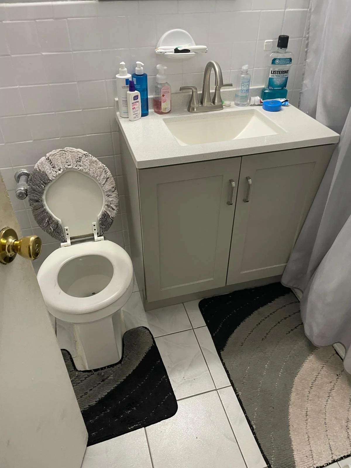 A modern backyard with a swimming pool, lounge chairs, and a patio with outdoor furniture, surrounded by trees and desert landscaping.