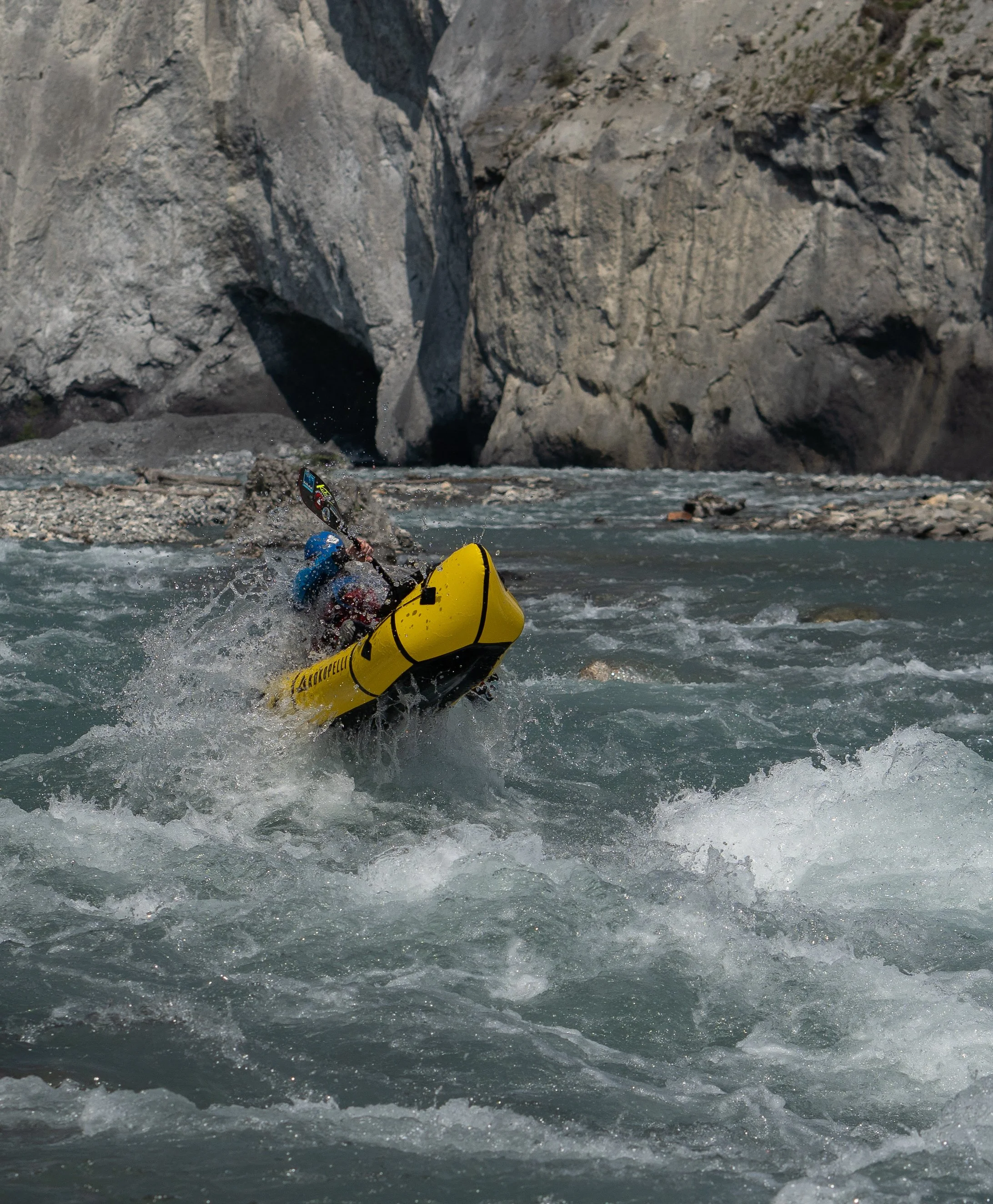 Mark Oates of Packrafting Tasmania boofing waves in Switzerland