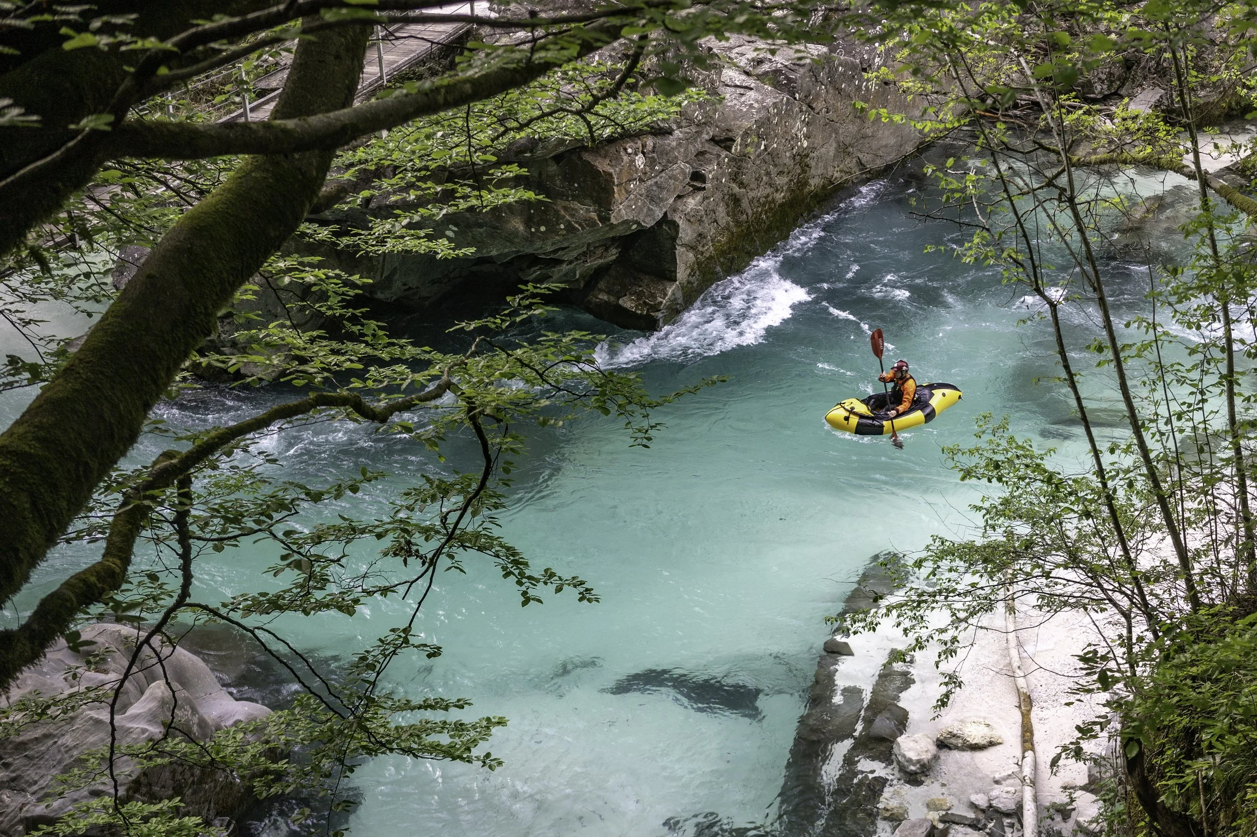 Jen MacGibbon packrafting on the Soca River in Slovenia