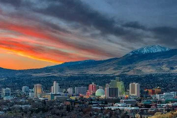 Sunset over Reno, Nevada with Sierra Nevada Mountains in background.
