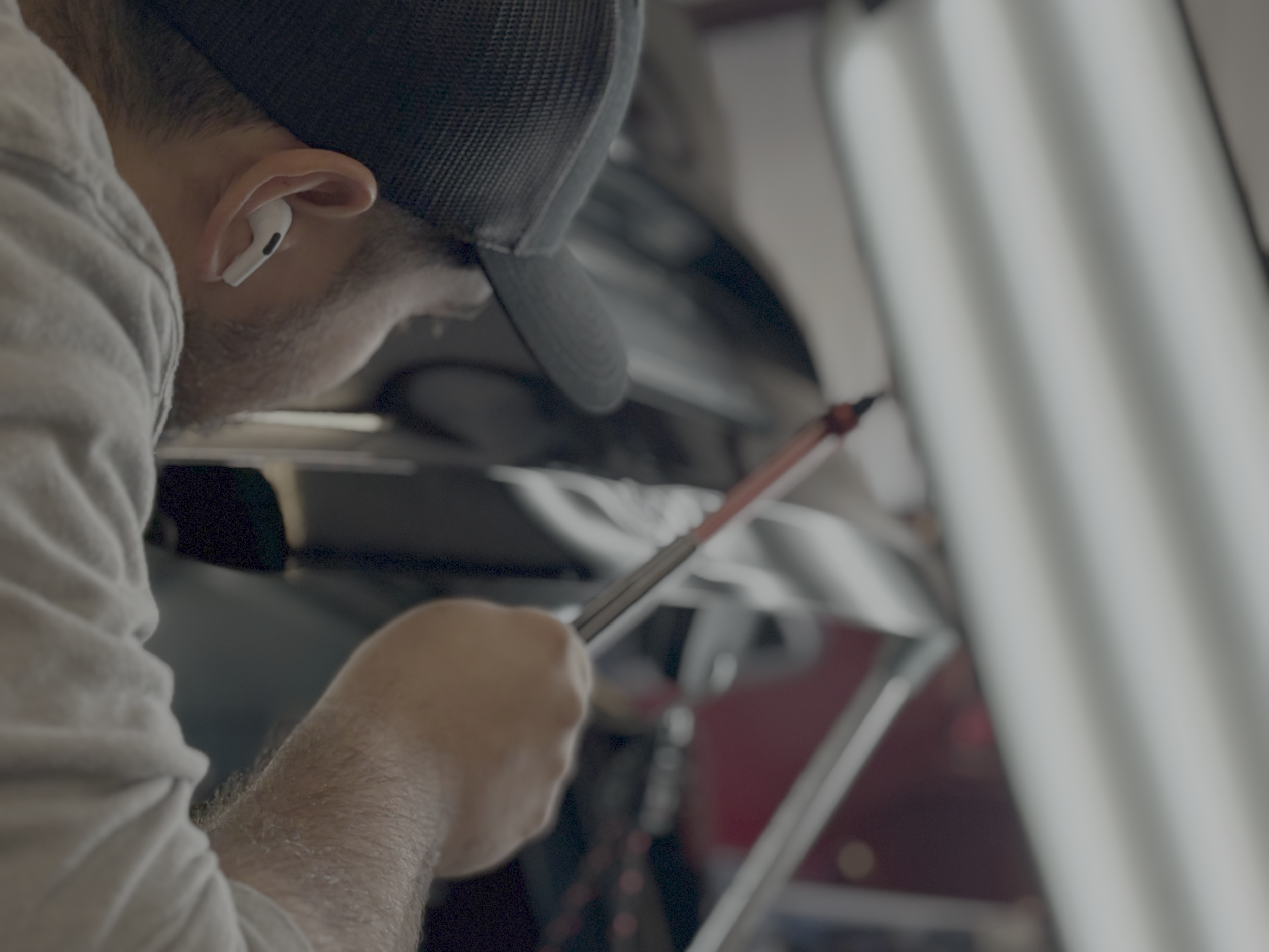 Paintless dent repair technician removing dent in Houston TX