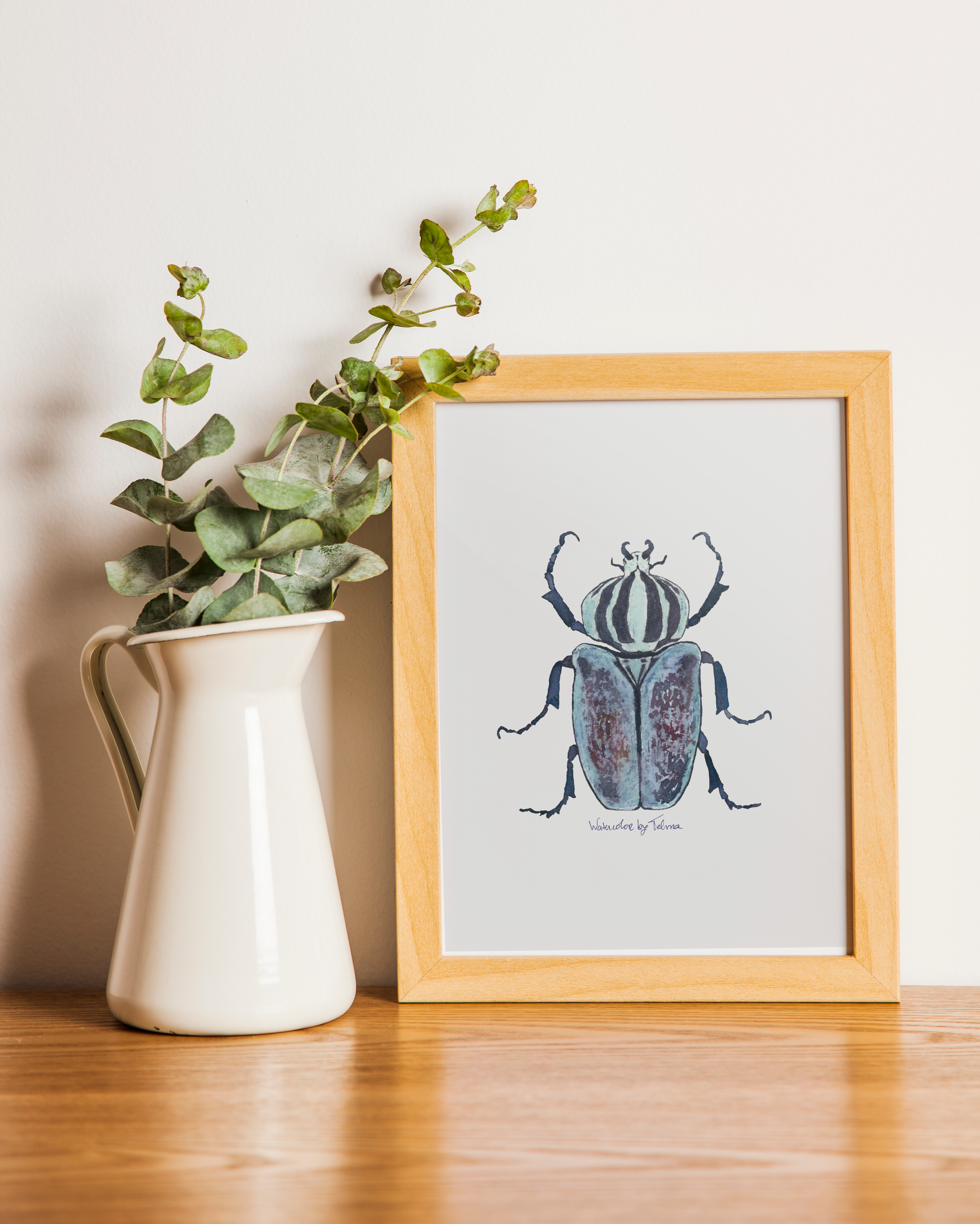 Blue Beetle painting in frame